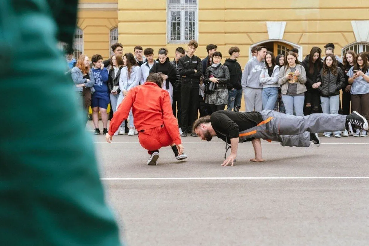 Breaking performance in front of a school crowd